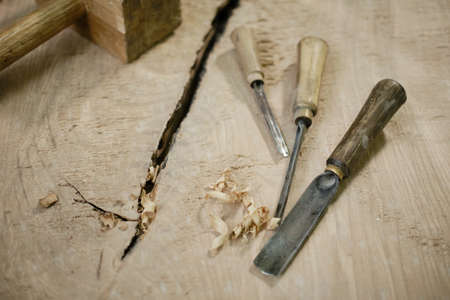 Work table of a carpenter with a gouge and a pile of wood chips. Vercion 2