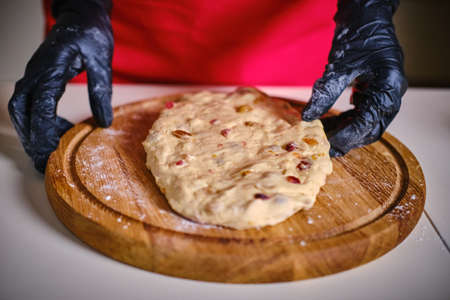 Female hands kneading cookie dough on table close up. Vercion 3の写真素材