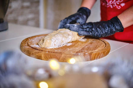 Female hands kneading cookie dough on table close up. Vercion 4の写真素材