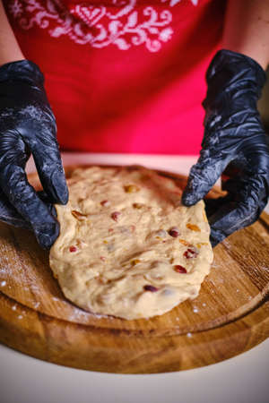 Female hands kneading cookie dough on table close up. Vercion 4の写真素材