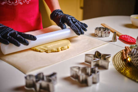 Womans hands roll the dough. Protection Symbol, heat comfort. V4の写真素材