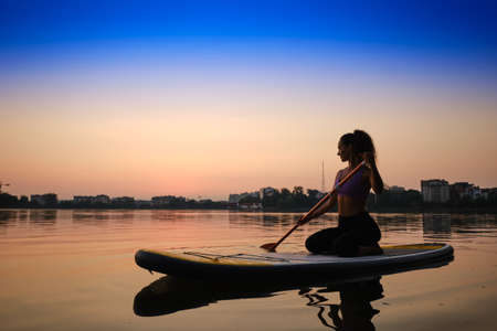 Sunset, Woman Silhouette on lake Stand Up Paddle Board SUP, Version 2