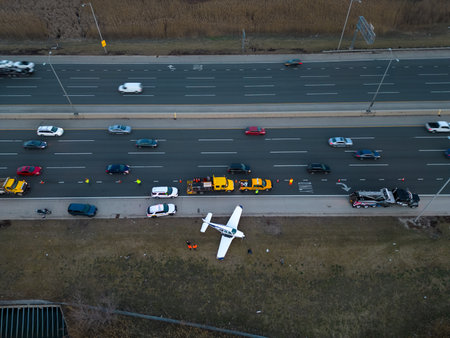 Emergency airplane landing on highway. Above wide Drone shot