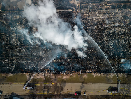 Top wide Aerial view of firemen fighting with fire near biulding.の写真素材