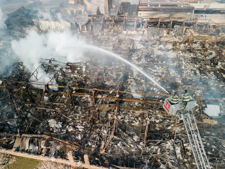 Shot of firemen fighting with fire near biulding.の写真素材