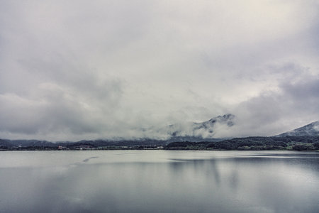 a beautiful, cloudy view of the lakeの写真素材