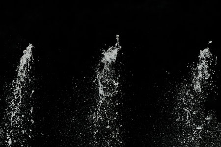 Water splashes on a black background.の写真素材