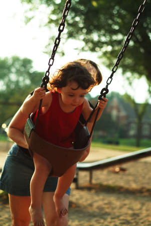 little girl on swing