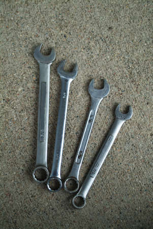 various wrenches on concrete floorの写真素材