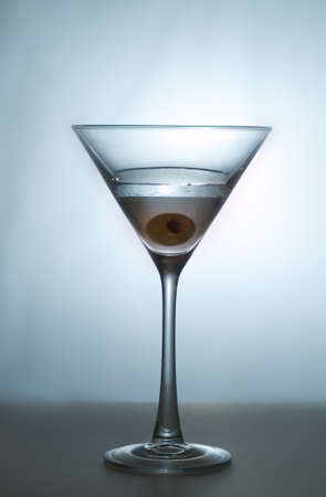 studio shot of martini and oliveの写真素材