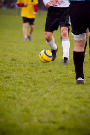 men kicking soccer ballの写真素材