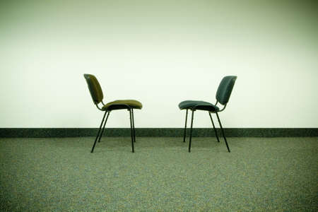 two chairs in office facing each otherの写真素材