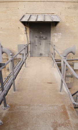 Industrial Door at the end of a Bridgeの写真素材