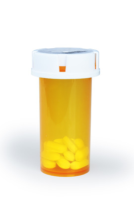 Perscription Pills in Orange Container on White Backgroundの写真素材