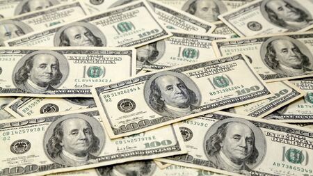 Wide Full Screen Money Pile of 100 Dollar Billsの写真素材