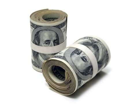 Money Rolls of One Hundred Dollar Bills on White Backgroundの写真素材