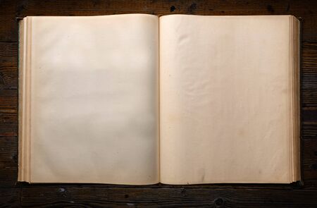 Blank Page of Historic Old Book on Wood Tableの写真素材