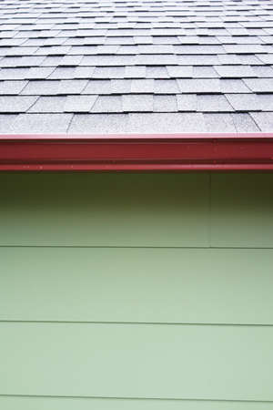 Side of Green Shed with Red Gutter Vertical Viewの写真素材