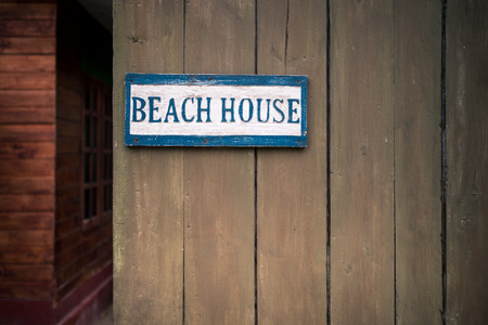 a Beach house sign on wooden fenceの写真素材
