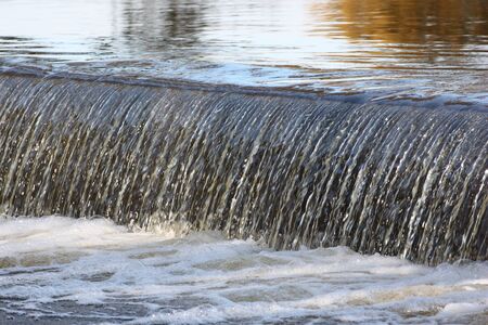 the stream of a little river in fall