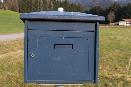 A nice old blue letterbox in autumnの写真素材