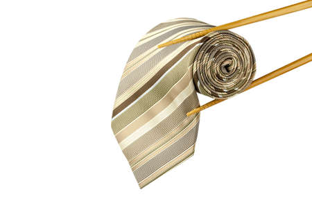 Male necktie roll as sushi with chopsticks isolated on white backgroundの写真素材