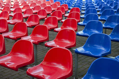 Rows of red and blue stadium seatsの写真素材