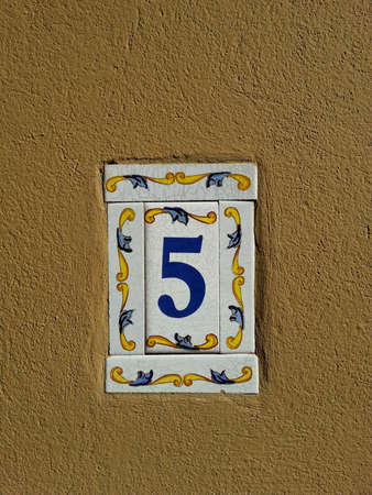 Decorated house number plate on the wallの素材