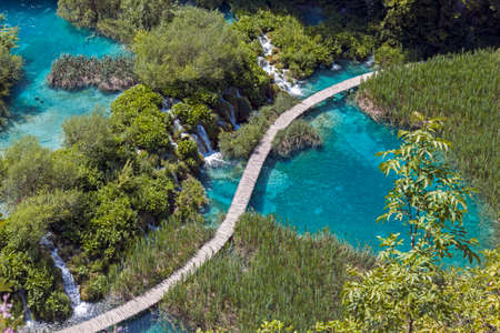 Waterfalls and wooden walkway at Plitvice Lakes National Park in Croatiaの写真素材