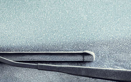 An abstract picture of frosty vehicle windscreen and wipersの写真素材