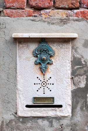 Traditional decorative doorbell in Venice, Italyの写真素材