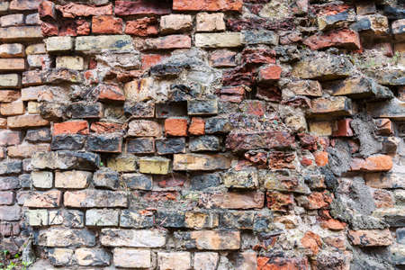 Dirty abandoned old brick wall backgroundの写真素材