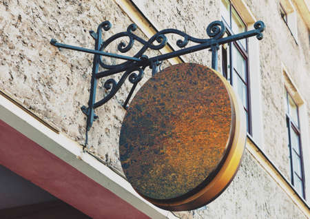 Blank rounded and rusty outdoor business signage mock up to add company logoの写真素材
