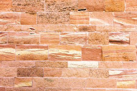 Textured red stone wall as perfect backgroundの写真素材