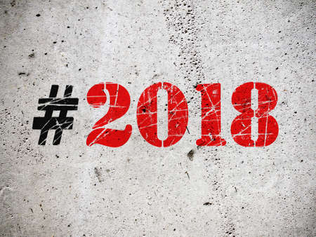 New Year 2018 hashtag grafitti on grunge concrete wall illustrationの写真素材