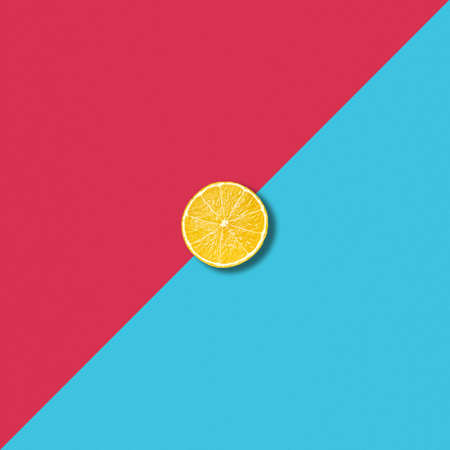 Minimalist abstract illustration with single lemon slice on vibrant red and turquoise backgroundの写真素材
