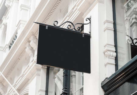 Classic style blank hanging company wall signboard mockup to add business logo, sign or nameの写真素材