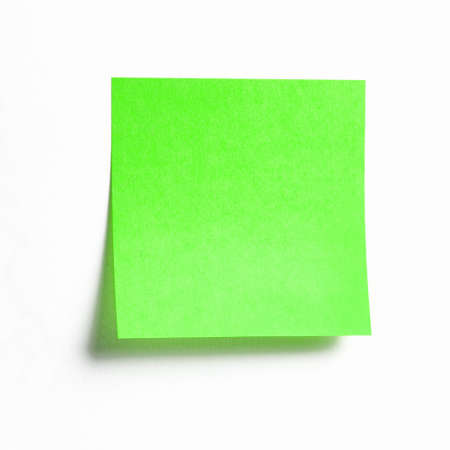 Vibrant green sticky note with shade isolated on white background, front view adhesive paper note with copy spaceの写真素材