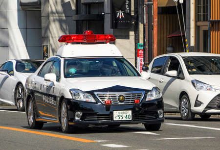 Kyoto, Japan - February 13, 2020: Japanese police patrol car on the street in Kyoto, Japanのeditorial素材