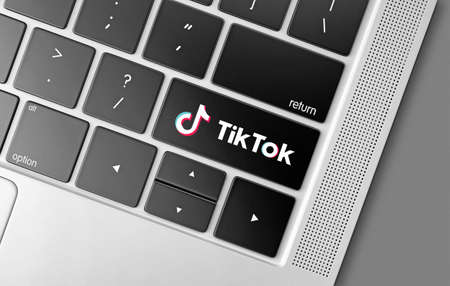 Tik Tok social networking service key on computer keyboard, modern technologies concept with Tik Tok logoのeditorial素材