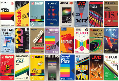 Vilnius, Lithuania - October 18, 2020: Collection of old vintage VHS video cassettes, colorful retro cover backgroundのeditorial素材