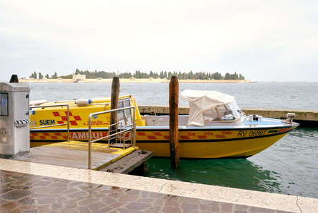 Venice, Italy - 22 November 2021: Yellow ambulance boat moored in the lagoon of Venice in Italyのeditorial素材