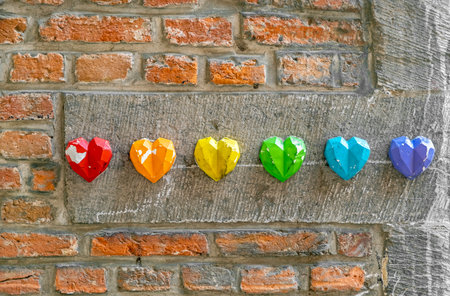 Rainbow flag decoration on brick wall, pride month conceptの写真素材