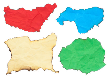 crumpled burned paper set in colors isolated on white backgroundの写真素材
