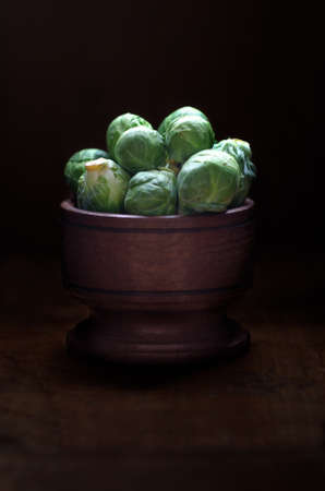 Brussels sprouts in a wooden bowl.の写真素材