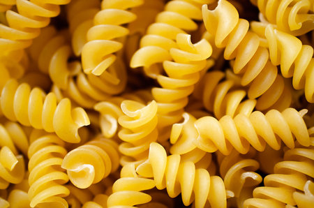 Uncooked spiral pasta. Top view.