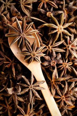 Star anise with a wooden spoon. Top view.の写真素材