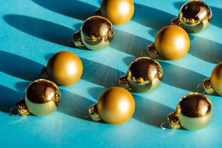 Cgristmas golden balls decorations on the turquoise backgroundの写真素材