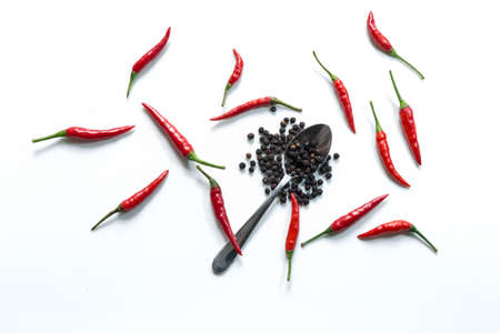 Fresh red hot thai chili and pepper in spoon on white backgroundの写真素材
