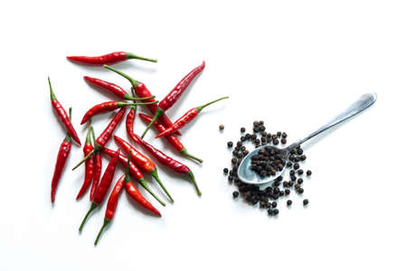 Fresh red hot thai chili and pepper in spoon on white backgroundの写真素材